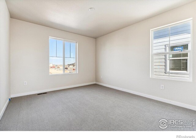 unfurnished room with carpet