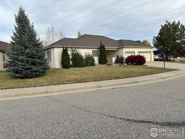 exterior space with a garage and a front yard