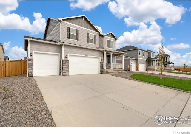 view of front property with a porch and a garage