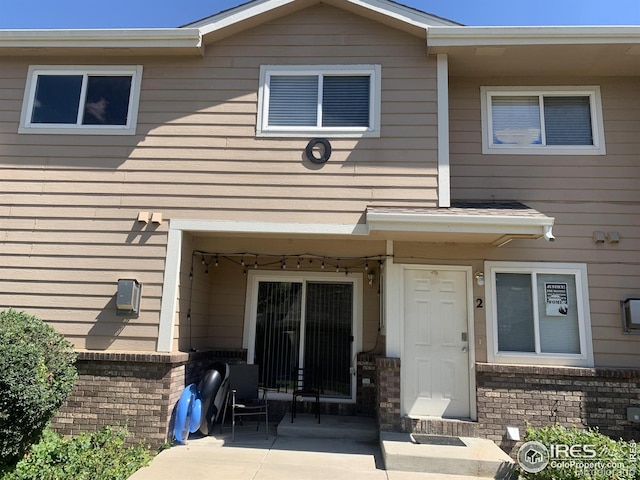 property entrance featuring a patio