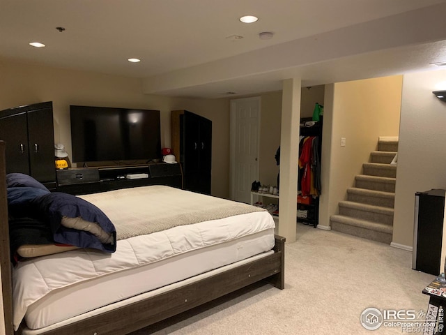 carpeted bedroom with a closet