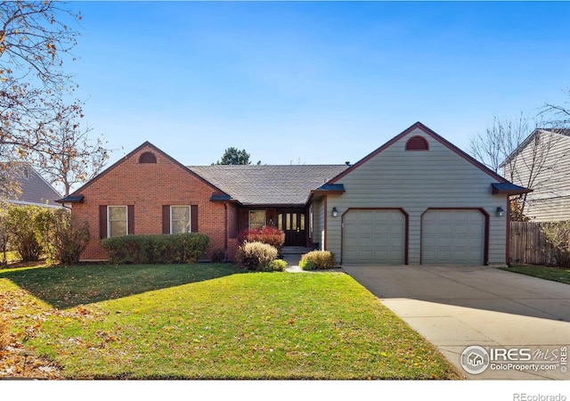 ranch-style home with a front yard and a garage