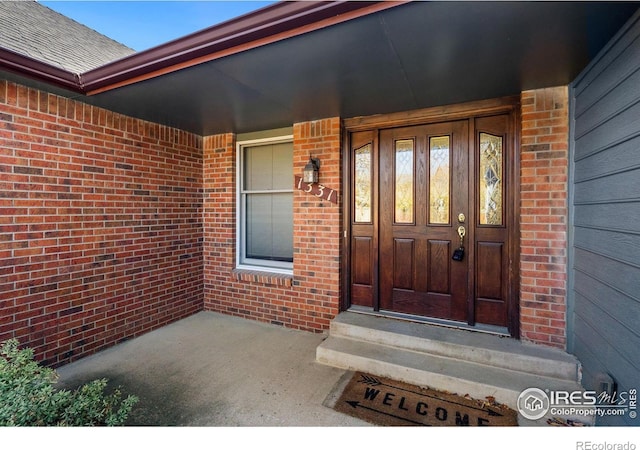 doorway to property featuring a porch