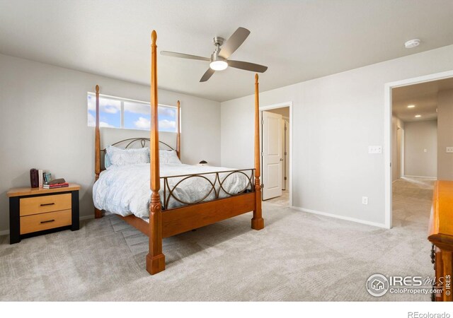 bedroom featuring ceiling fan and light carpet