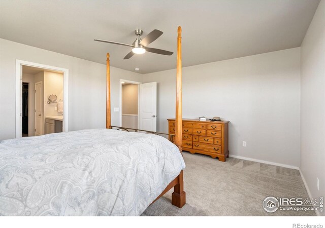 carpeted bedroom with connected bathroom and ceiling fan