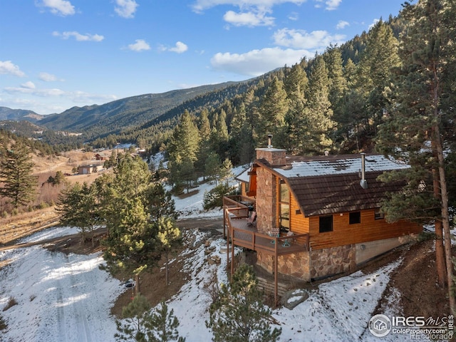 snowy aerial view with a mountain view