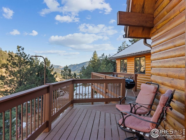 wooden terrace with a mountain view