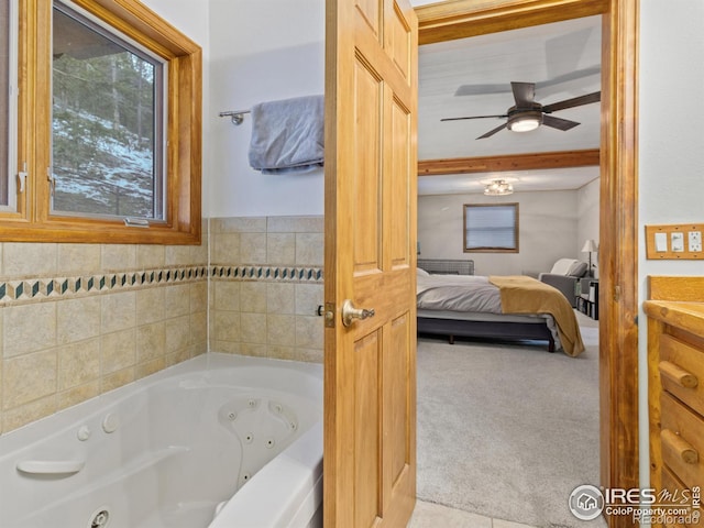 bathroom featuring ceiling fan and a washtub