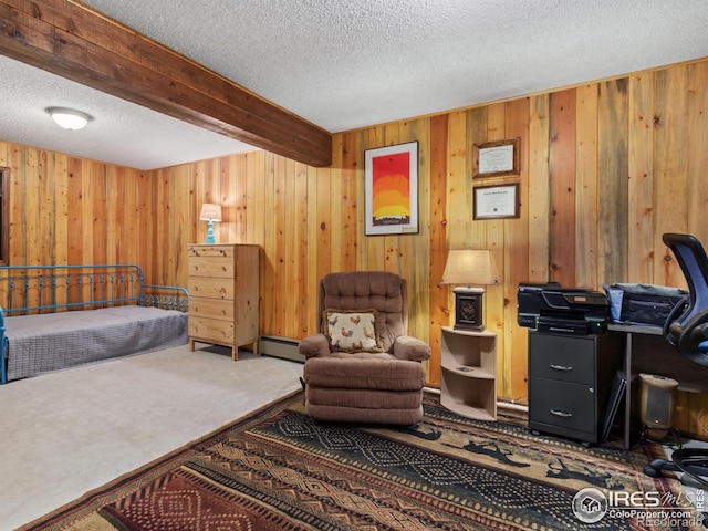 carpeted bedroom with beamed ceiling, a textured ceiling, baseboard heating, and wooden walls