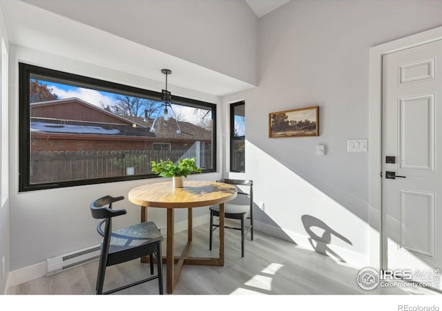 dining area with light hardwood / wood-style flooring