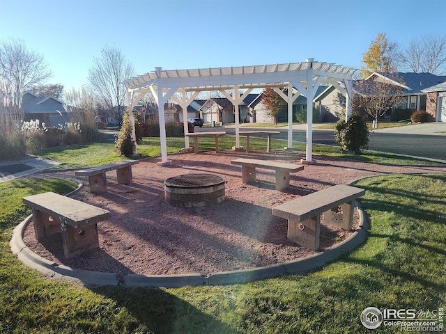 view of home's community featuring a pergola, a yard, and a fire pit