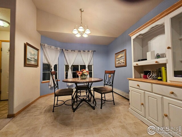 dining area featuring vaulted ceiling and a notable chandelier