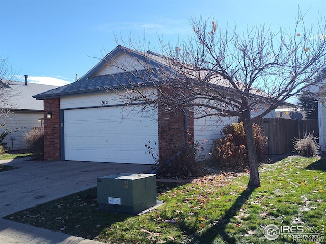 view of side of property featuring a garage