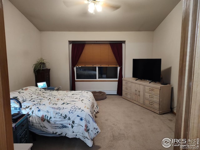 bedroom with ceiling fan and light colored carpet