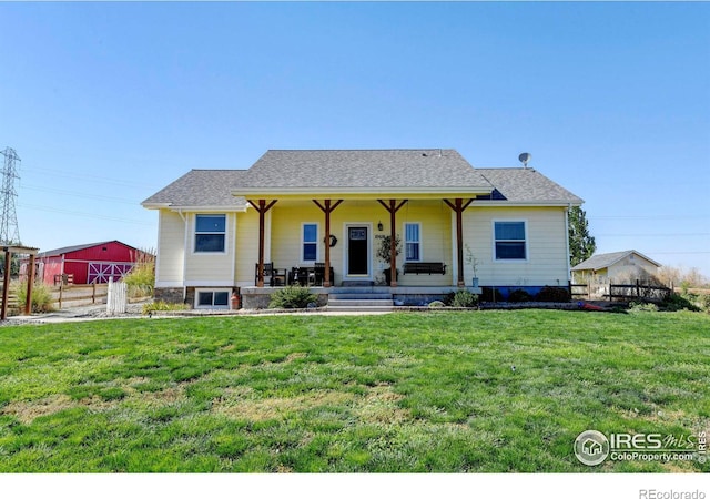 view of front of home featuring covered porch and a front yard