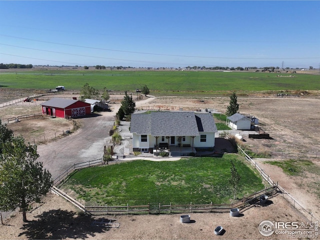 birds eye view of property featuring a rural view