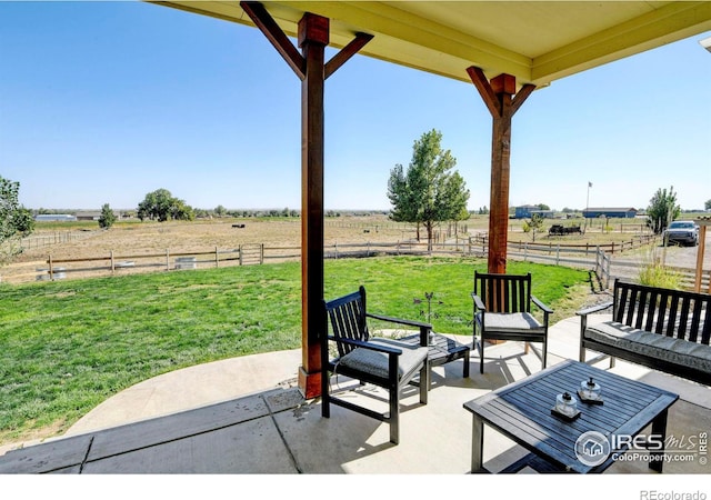 view of patio featuring a rural view and an outdoor hangout area