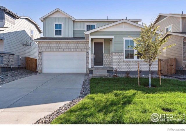 view of front of house featuring a garage and a front yard