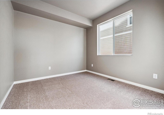 view of carpeted spare room