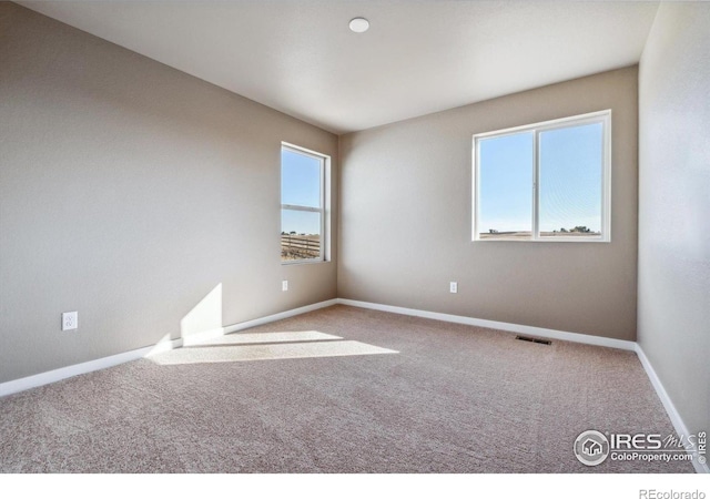 unfurnished room with carpet floors