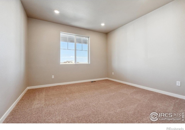 view of carpeted spare room