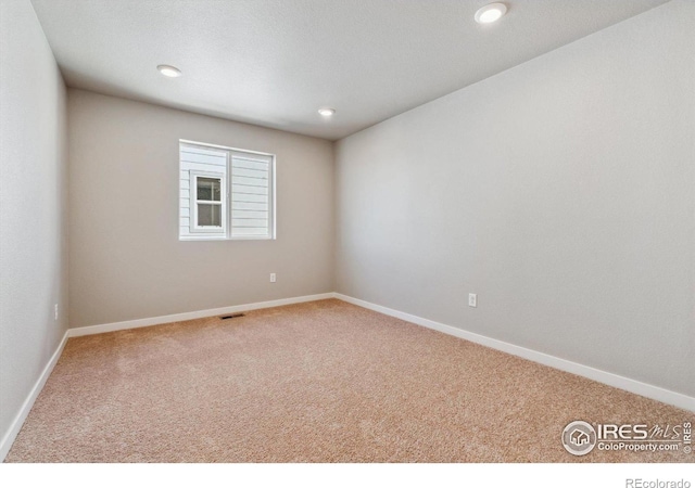 empty room with carpet flooring