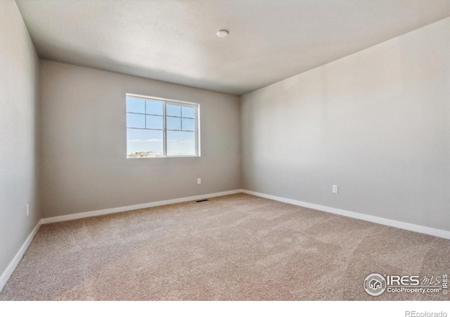 empty room with carpet flooring