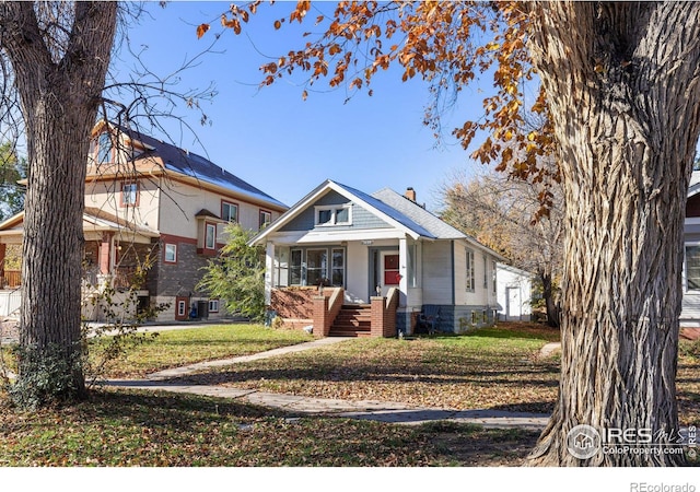 view of front facade with a porch and a front yard