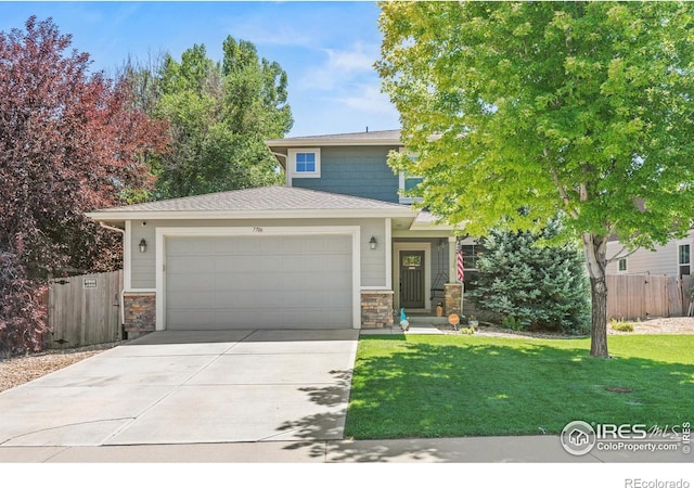 view of front of house featuring a garage and a front lawn