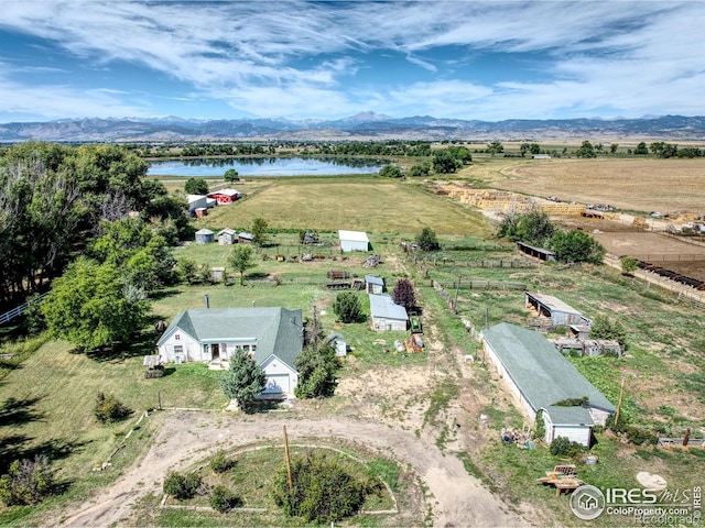 bird's eye view featuring a rural view and a water and mountain view