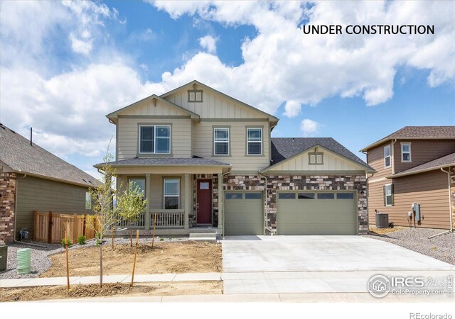 craftsman-style house featuring covered porch and a garage