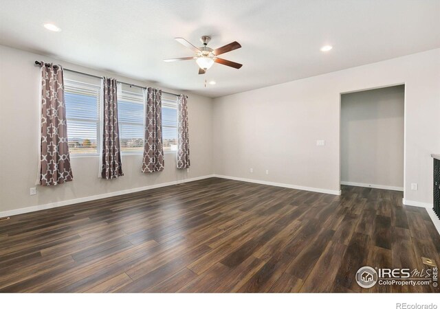 unfurnished room with ceiling fan, baseboards, dark wood-type flooring, and recessed lighting