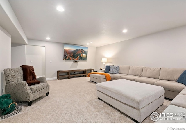 living room with carpet floors, recessed lighting, and baseboards