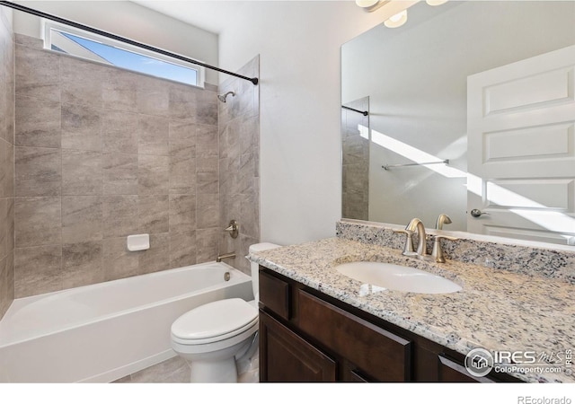 full bath featuring toilet, washtub / shower combination, and vanity