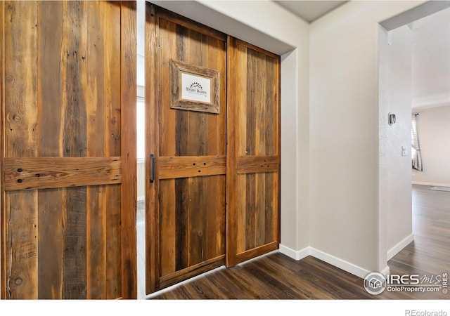 details featuring baseboards and wood finished floors