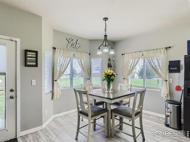 dining space featuring light hardwood / wood-style floors and plenty of natural light