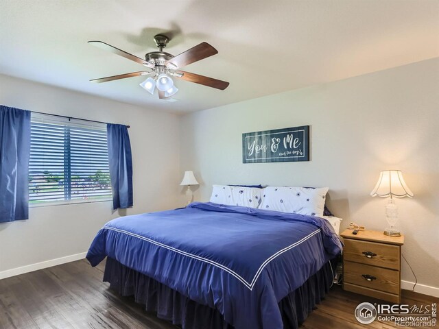 bedroom featuring ceiling fan and dark wood-type flooring