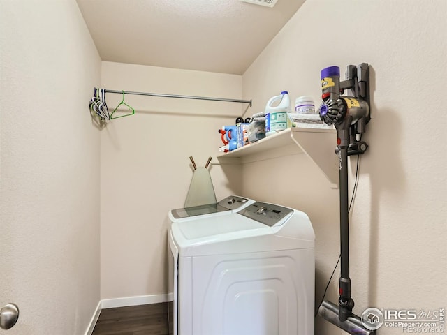 laundry room featuring hardwood / wood-style floors and separate washer and dryer