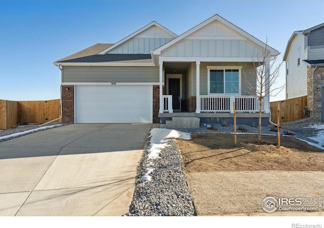 view of front of property with a garage and covered porch