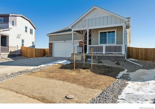 view of front facade with a garage and a porch