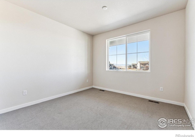 unfurnished room featuring carpet flooring