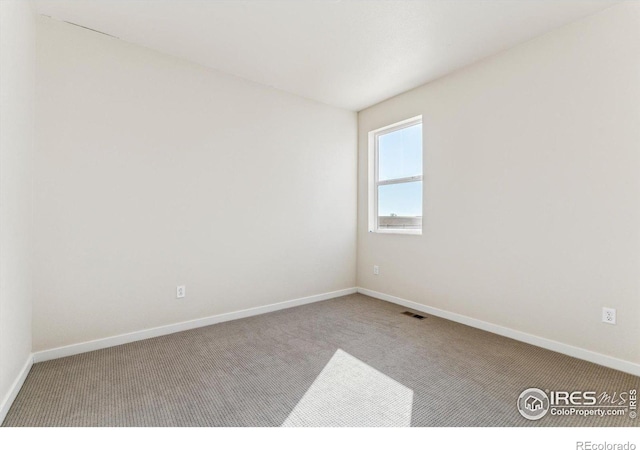 view of carpeted spare room