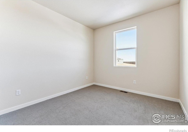 view of carpeted spare room