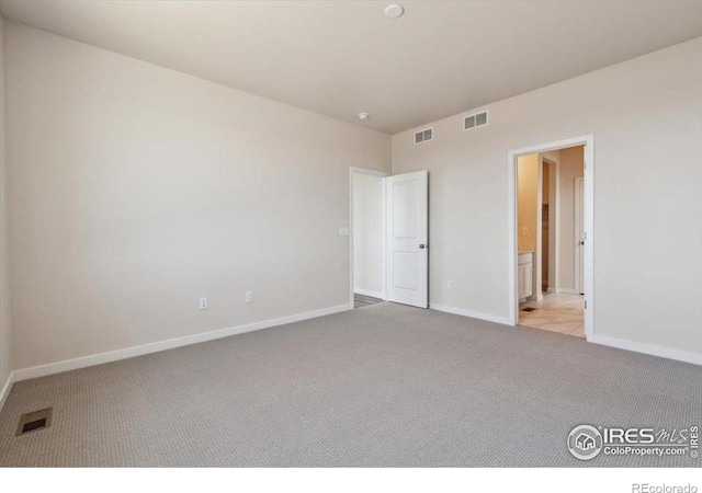 909 Harvard St, Johnstown, CO 80534 - carpeted spare room featuring baseboards and visible vents