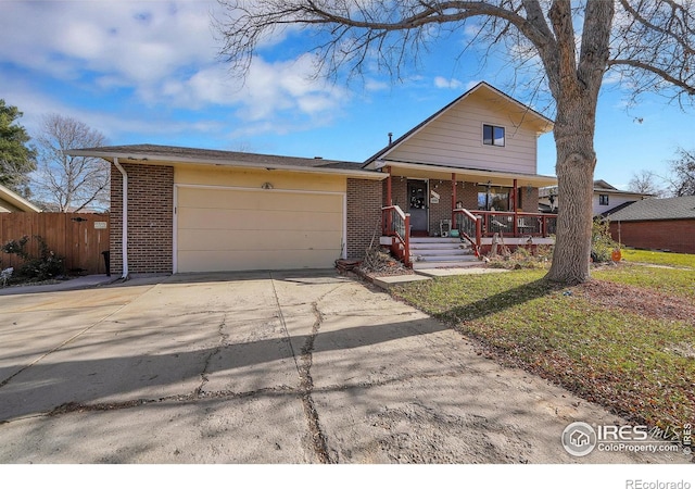 view of front of property with a garage and covered porch