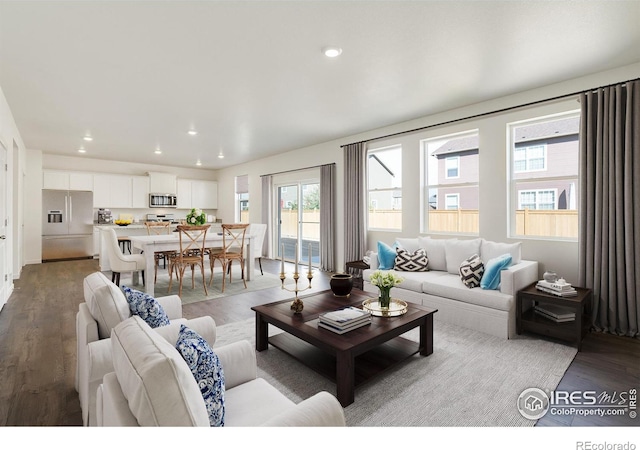 living room with a healthy amount of sunlight and light wood-type flooring