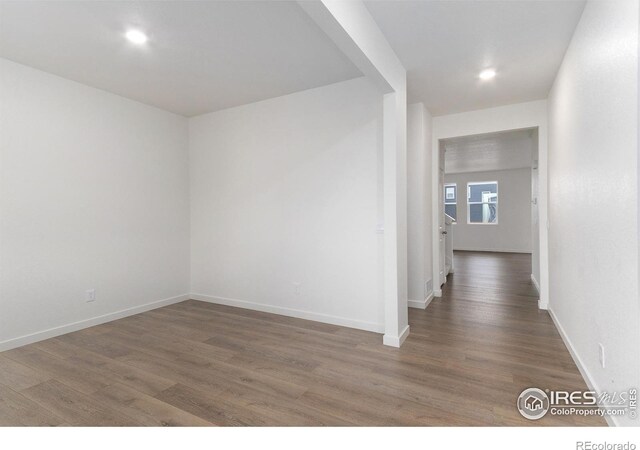 corridor featuring dark hardwood / wood-style floors