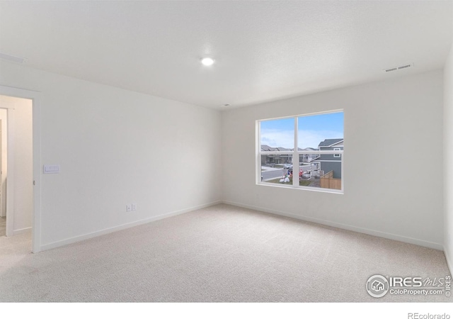 view of carpeted spare room