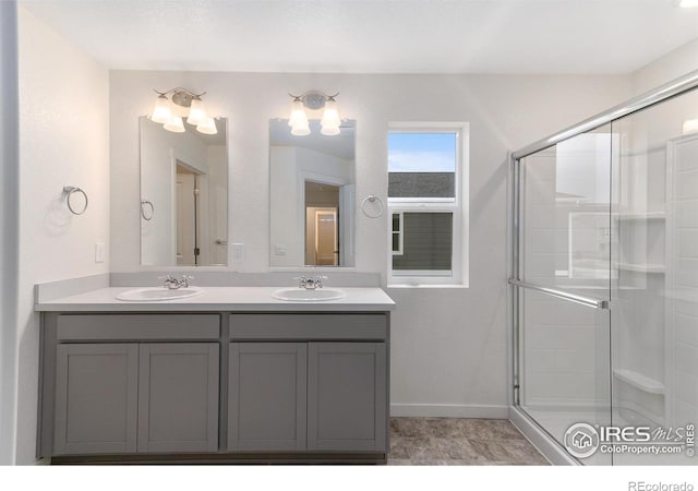 bathroom with vanity and an enclosed shower