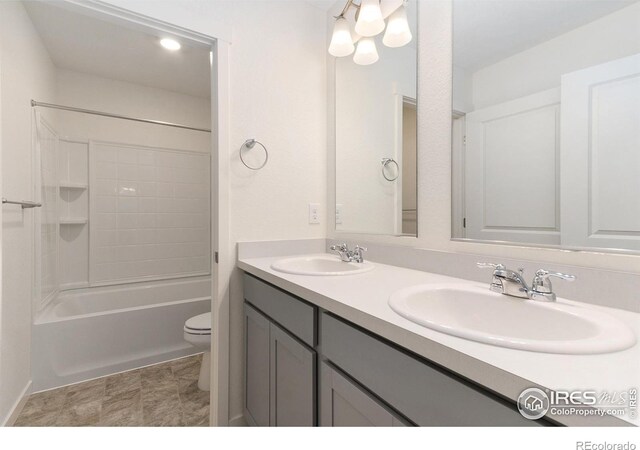 full bathroom featuring vanity, toilet, and bathtub / shower combination